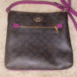 COACH Rowan File Bag In Signature Canvas. Brown, black and dark magenta.